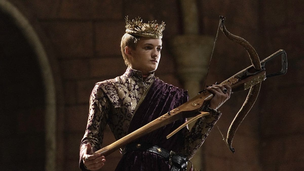 Jack Gleeson holds a crossbow