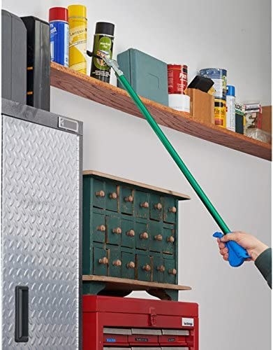 someone using the claw tool to lift something off of a high shelf