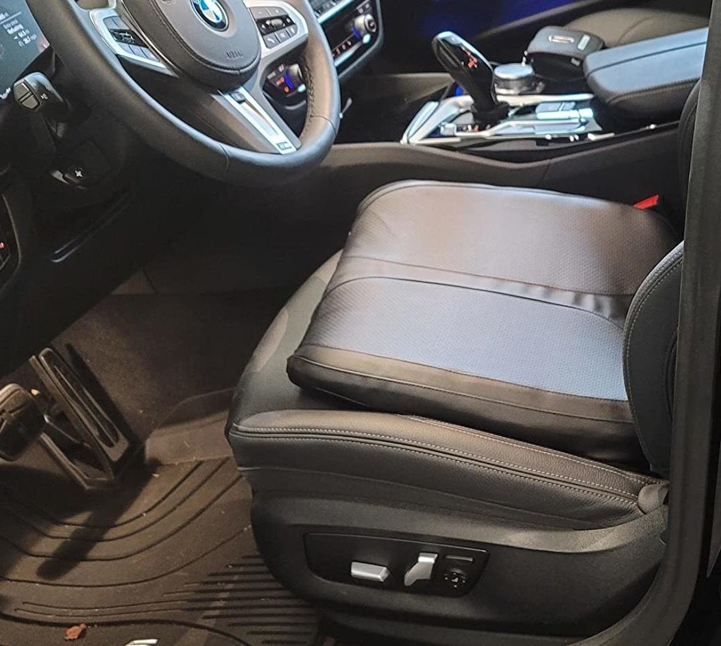 reviewer photo of the leather cushion on the driver&#x27;s seat of a car
