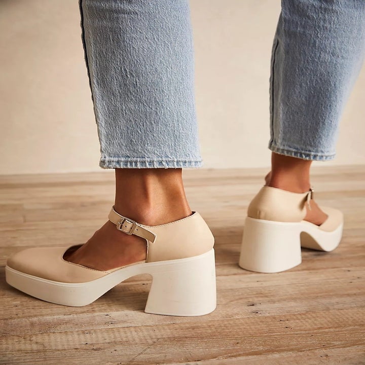 model wearing the beige and white mary janes