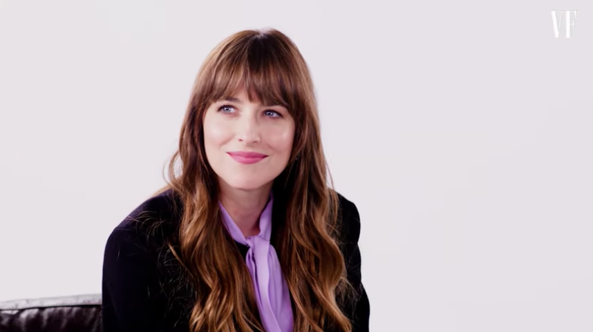 Dakota Johnson reacting during an interview