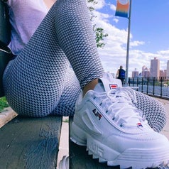 close-up of reviewer wearing the white platform sneaker