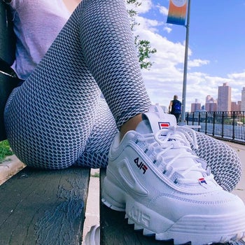 close-up of reviewer wearing the white platform sneaker