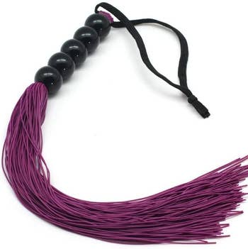 Purple whip with black handle