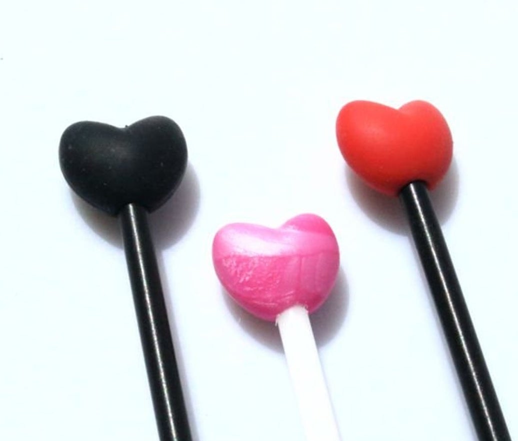Black, pink and red heart-shaped impact toys