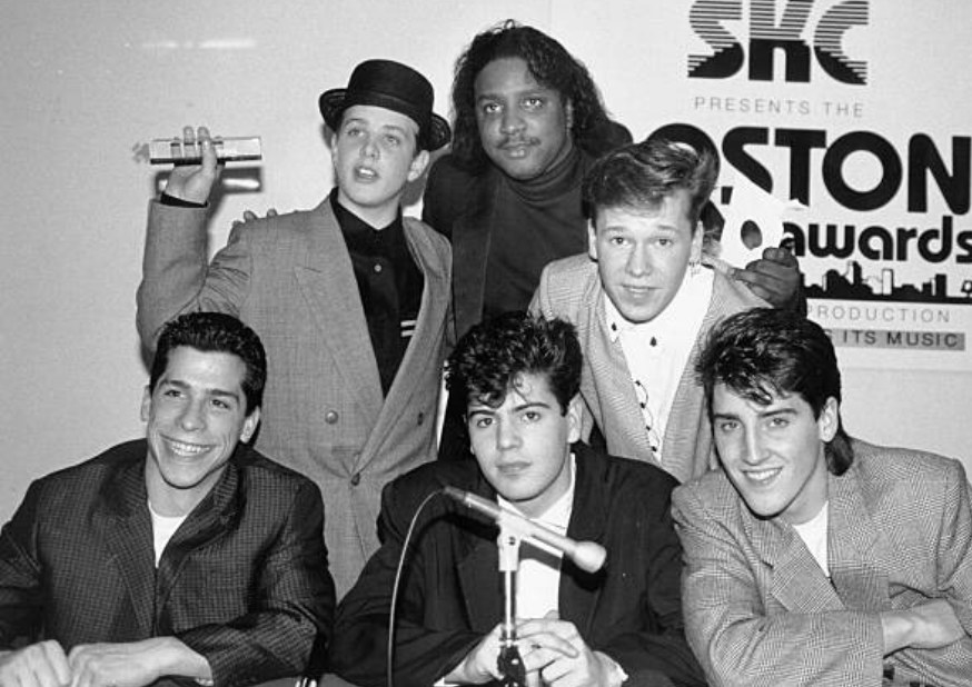 A picture of the New Kids on the Block and Maurice Starr circa 1990