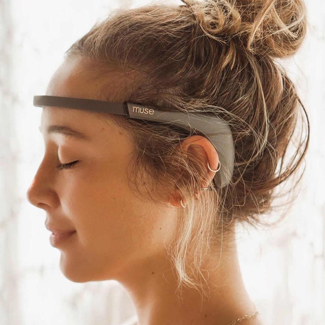 a person relaxing while wearing the meditation headband
