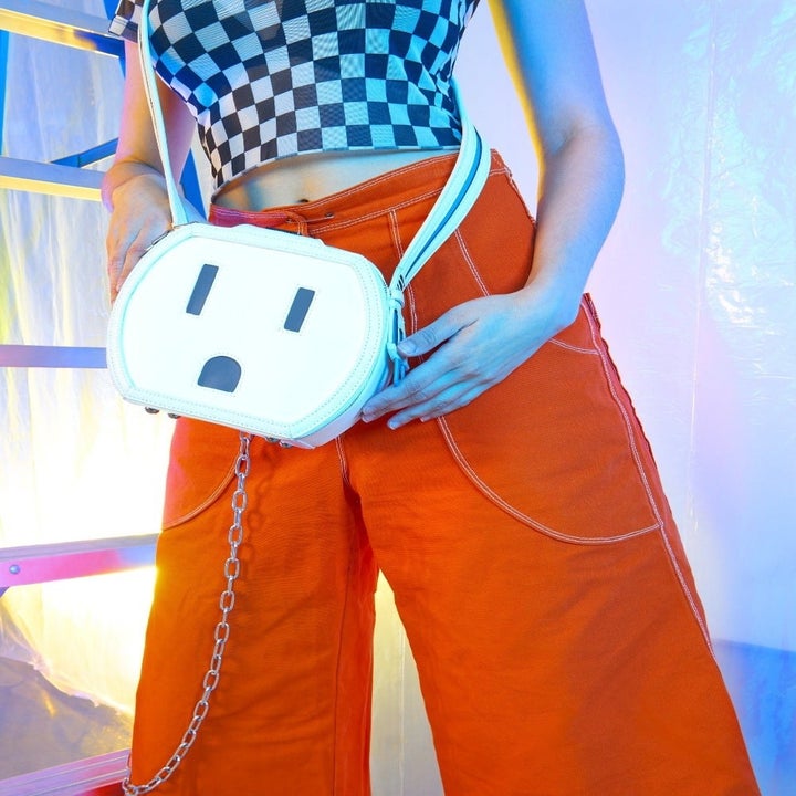model holding the white outlet bag