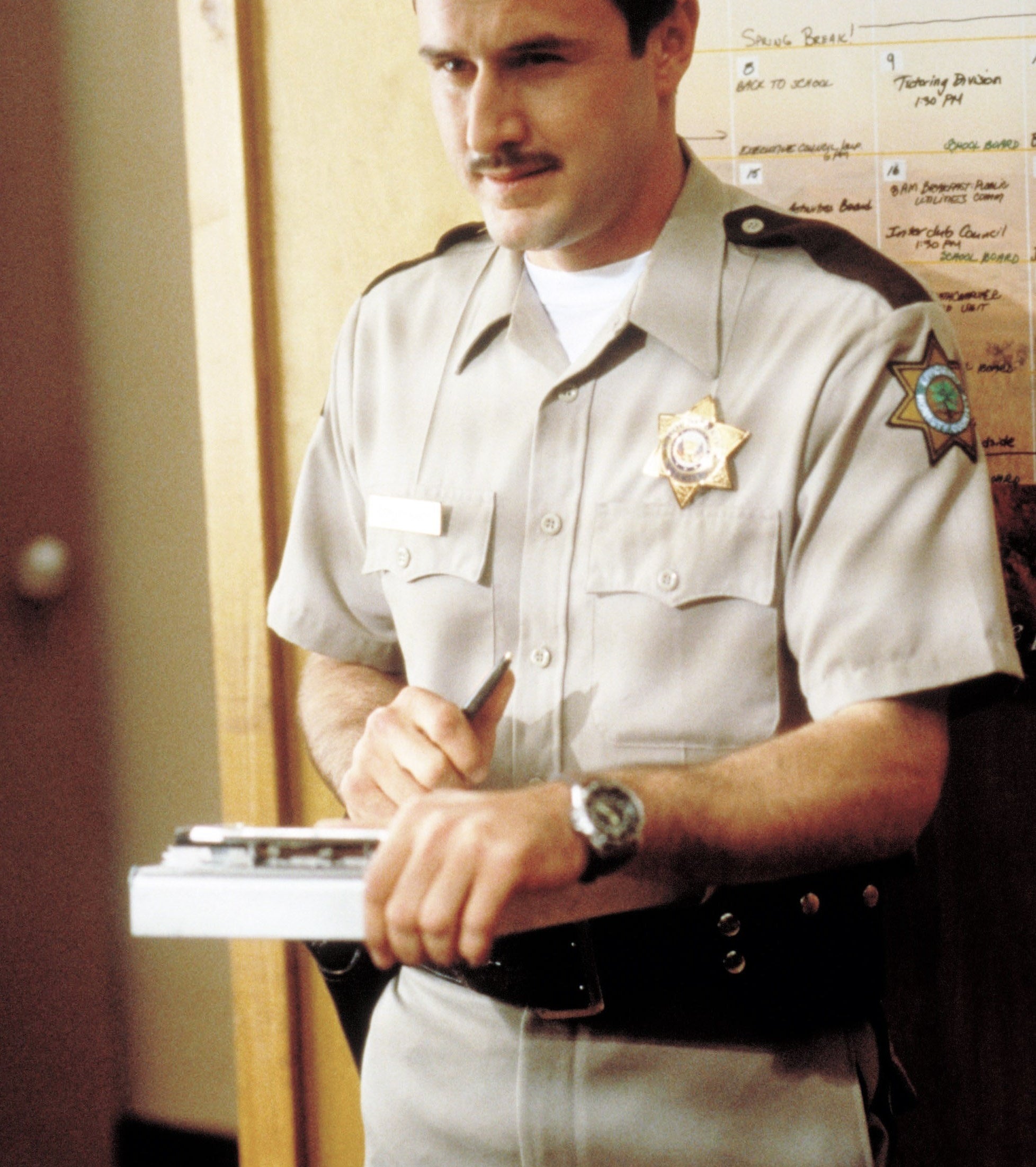 Deputy Dewey in uniform standing in the sheriff&#x27;s office