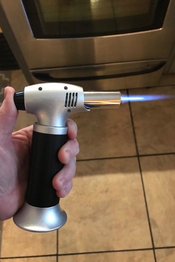 a review holds the blow torch on