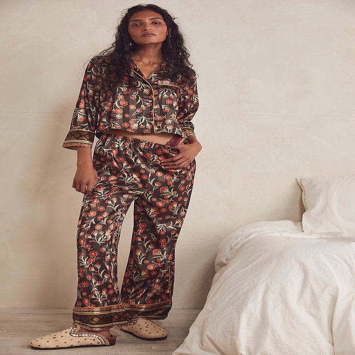 Model wearing brown flower pajamas