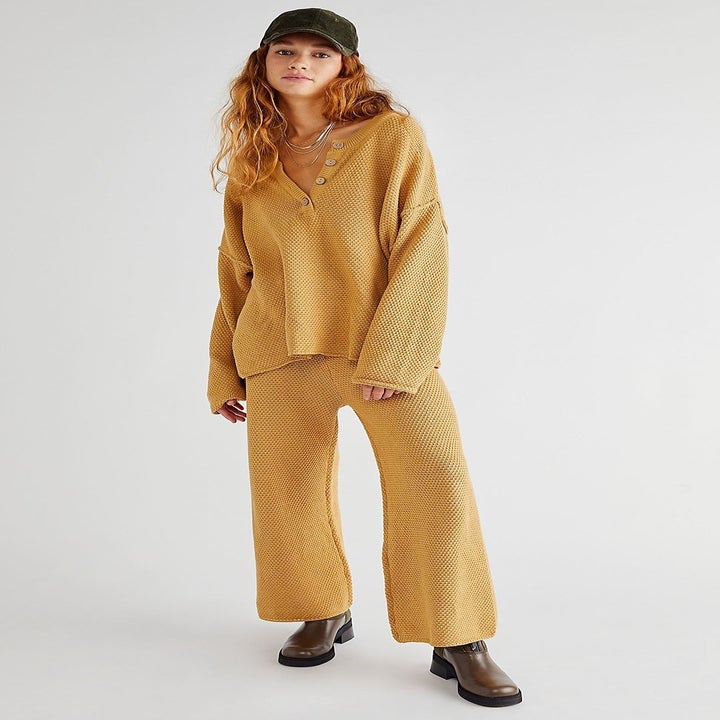 Model wearing mustard sweater set