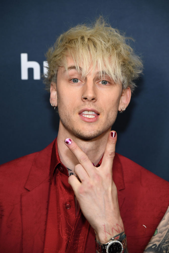 MGK showing off his manicure at a red carpet