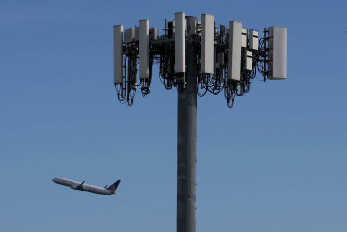 A plane flying past a cellphone tower