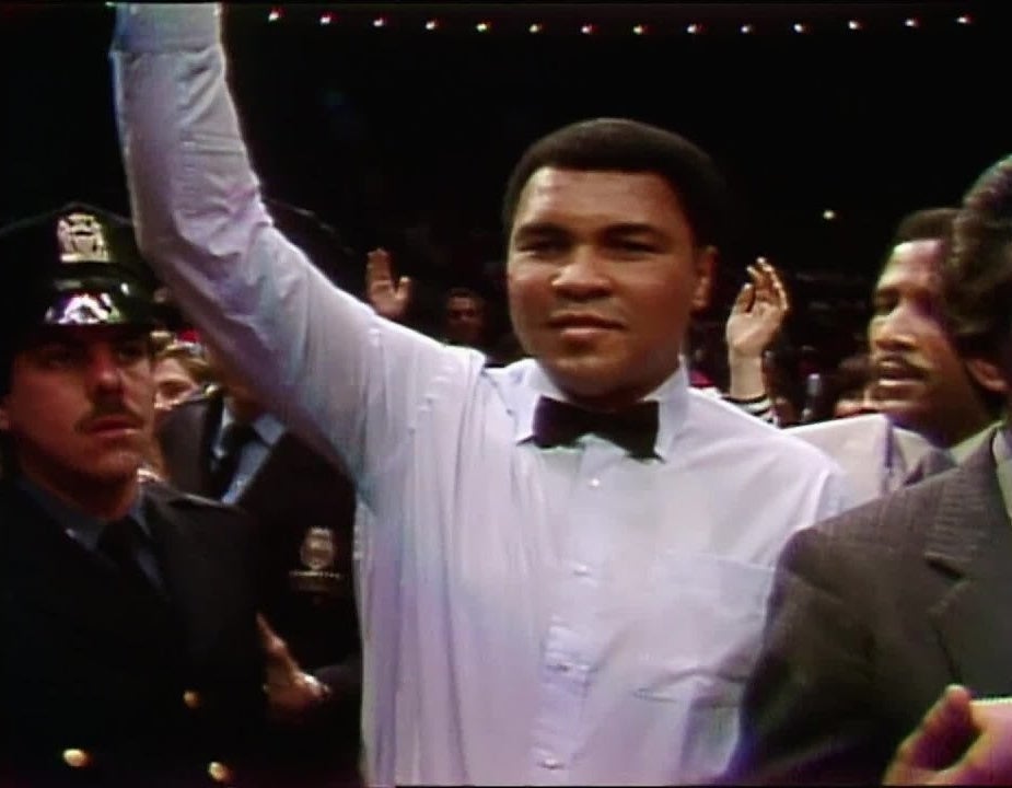 Muhammad Ali in a referee outfit