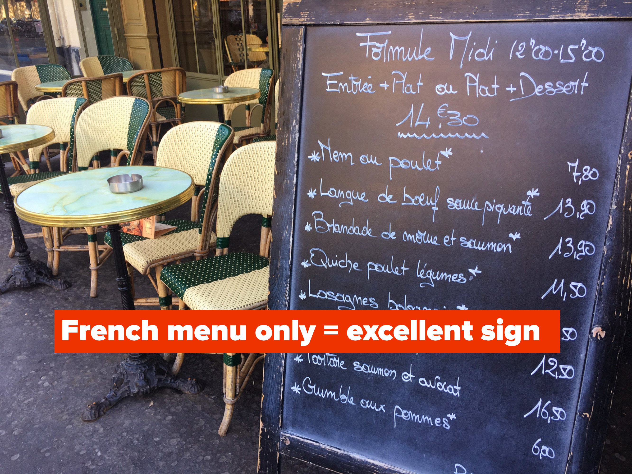 A bistro menu board on the terrace in Paris.