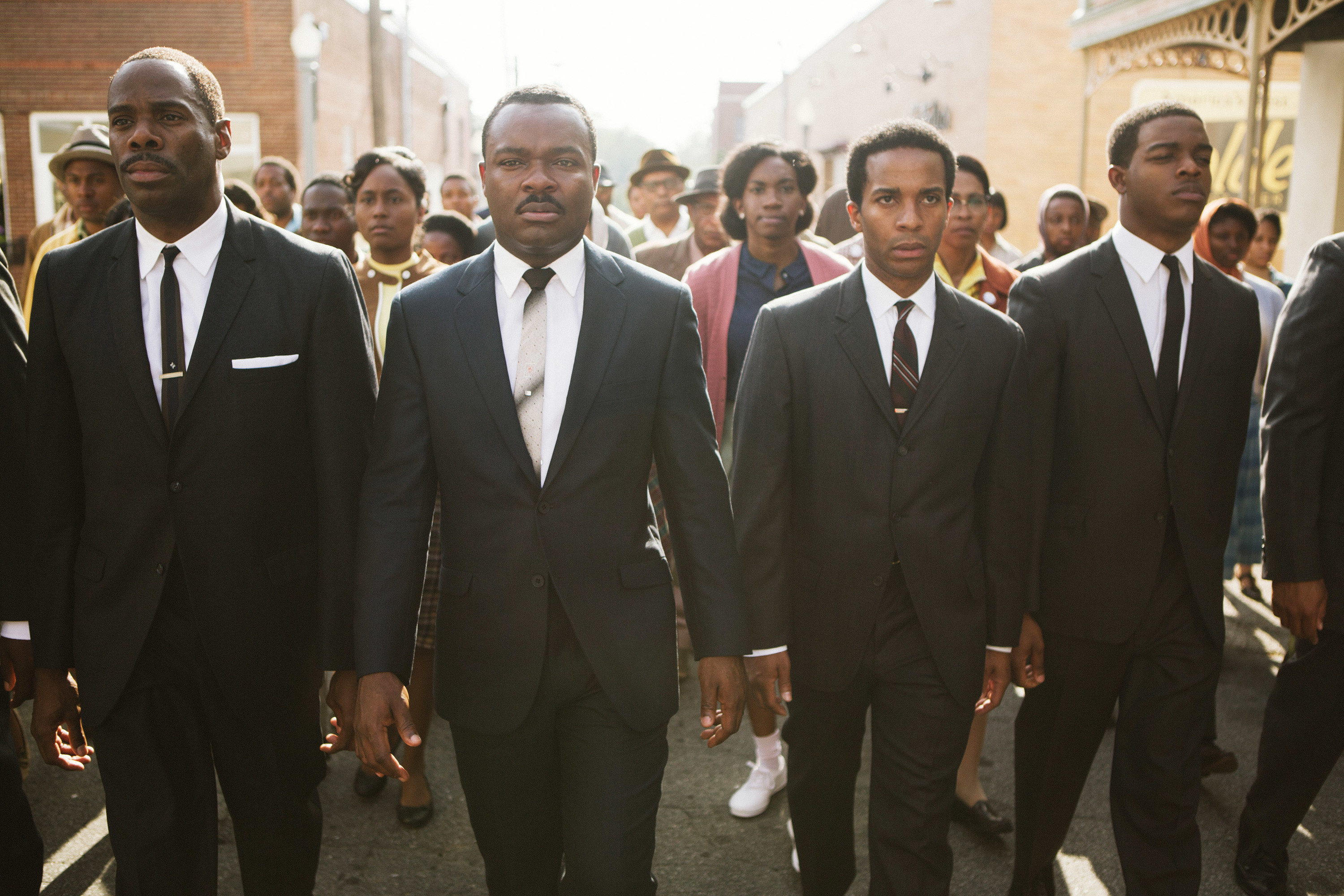 Colman Domingo as Ralph Abernathy, David Oyelowo, Andre Holland as Andrew Young, and Stephan James walk abreast