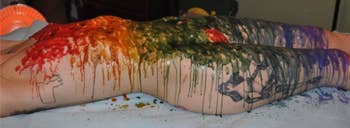 Model covered in rainbow wax