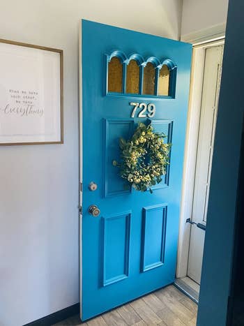 after: the same door, now in a bright blue