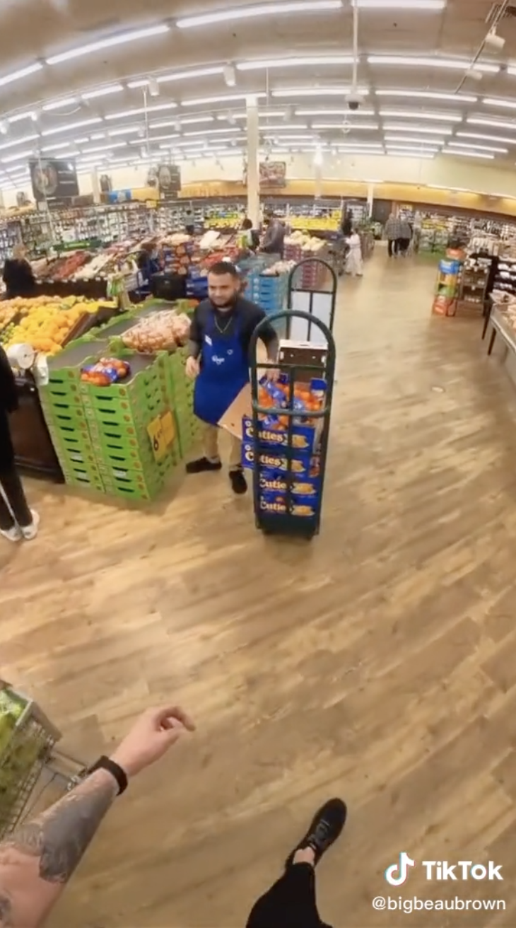 Store worker looking far away from a great height