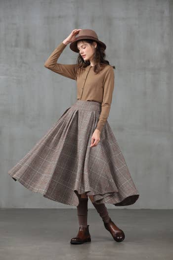 model wearing the plaid skirt