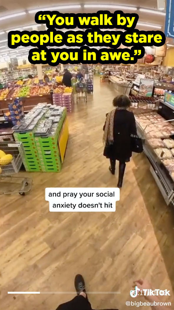 POV looking down on a woman checking out produce, with caption &quot;You walk by people as they stare at you in awe&quot;