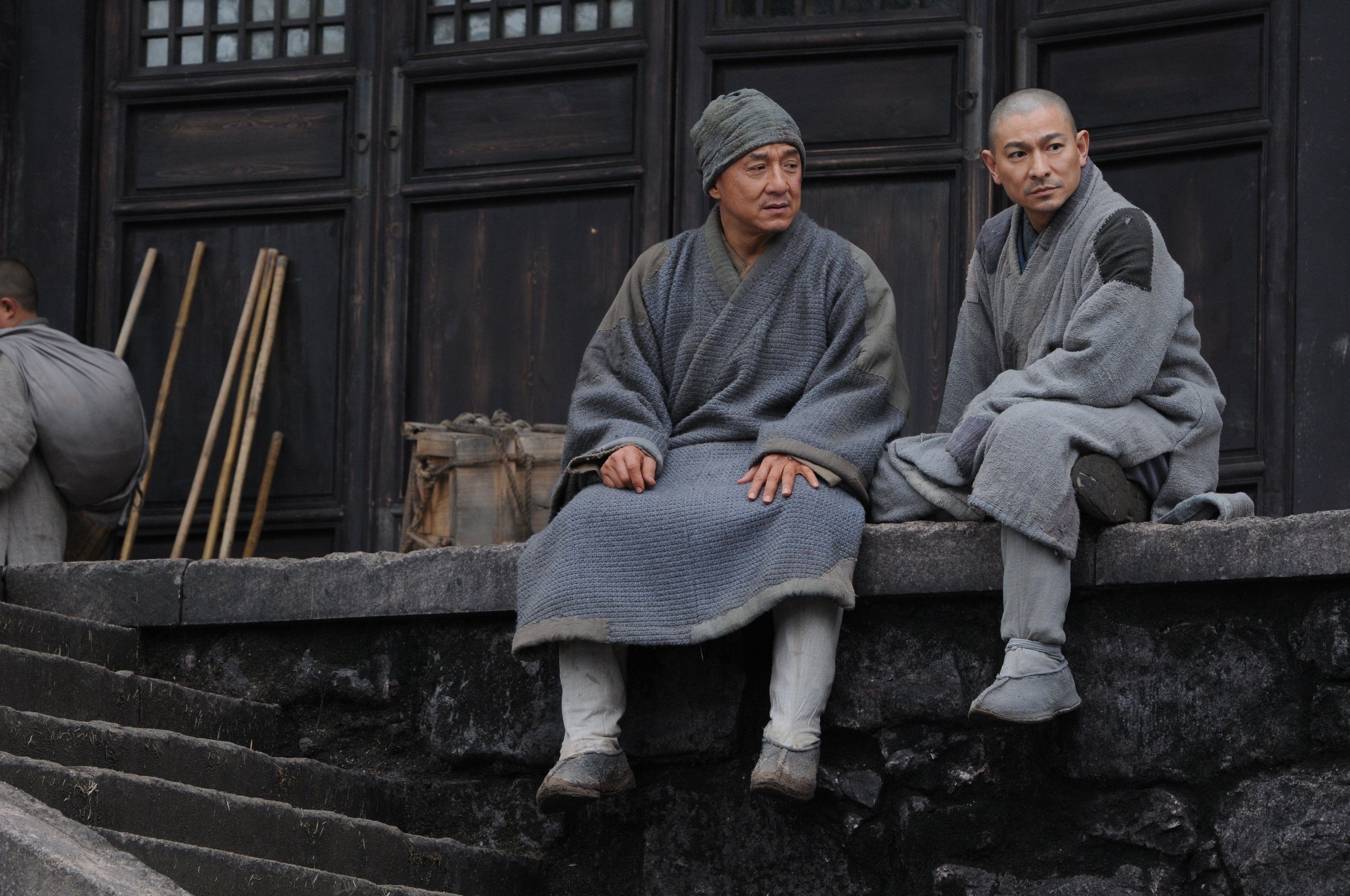 Jackie Chan and Andy Lau&#x27;s characters sitting together