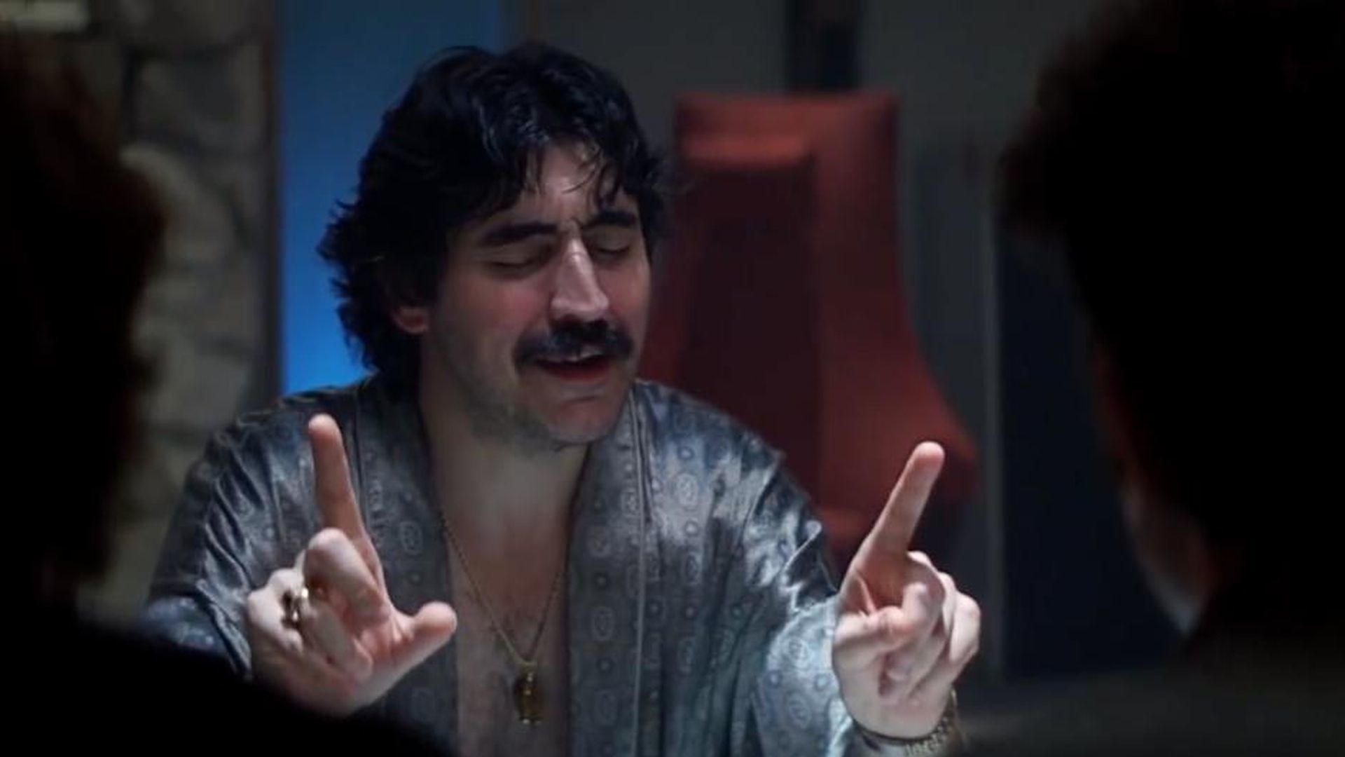 Alfred Molina wearing a silk robe on drugs