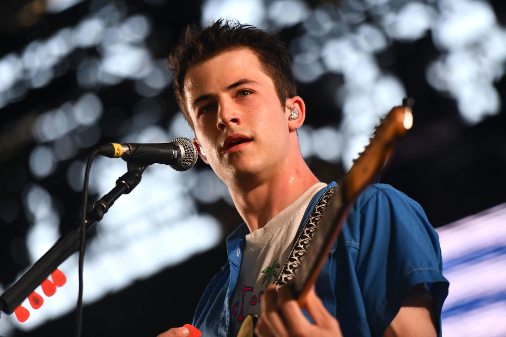 Dylan playing the guitar onstage