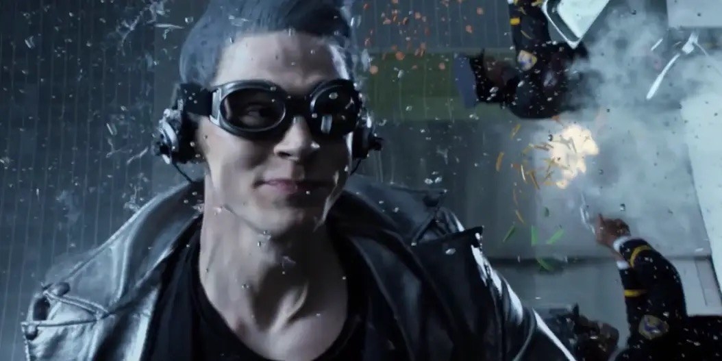Quicksilver wearing goggles, racing through a room fighting bad guys