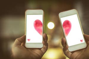 Two phones with either half of a heart
