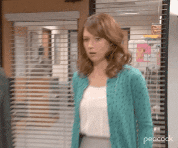 Erin Hannon as Ellie Kemper's jaw drops before looking into the camera and saying