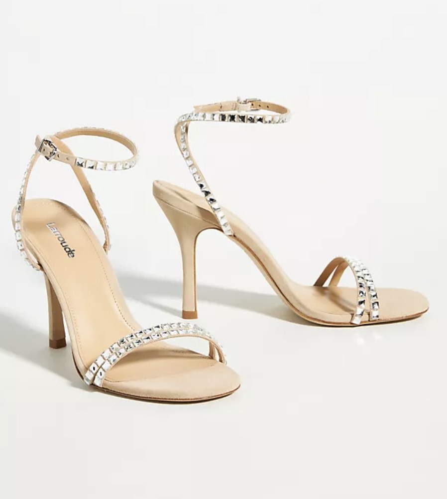 The light heels have a toe strap and angle strap with crystal detailing