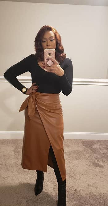 another reviewer wearing the brown faux leather skirt