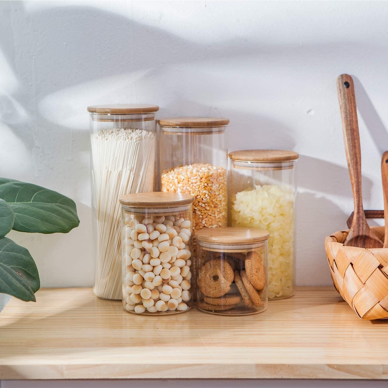 a set of five various sized canisters fill with snacks