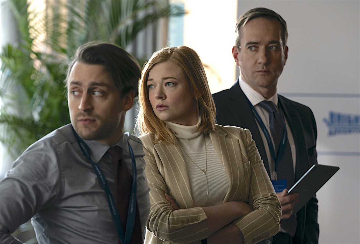 Kieran Culkin as Roman Roy Sarah Snook as Siobhan Roy and Matthew Macfayden as Tom Wambsgans looking off screen in an office in &quot;Succession&quot;