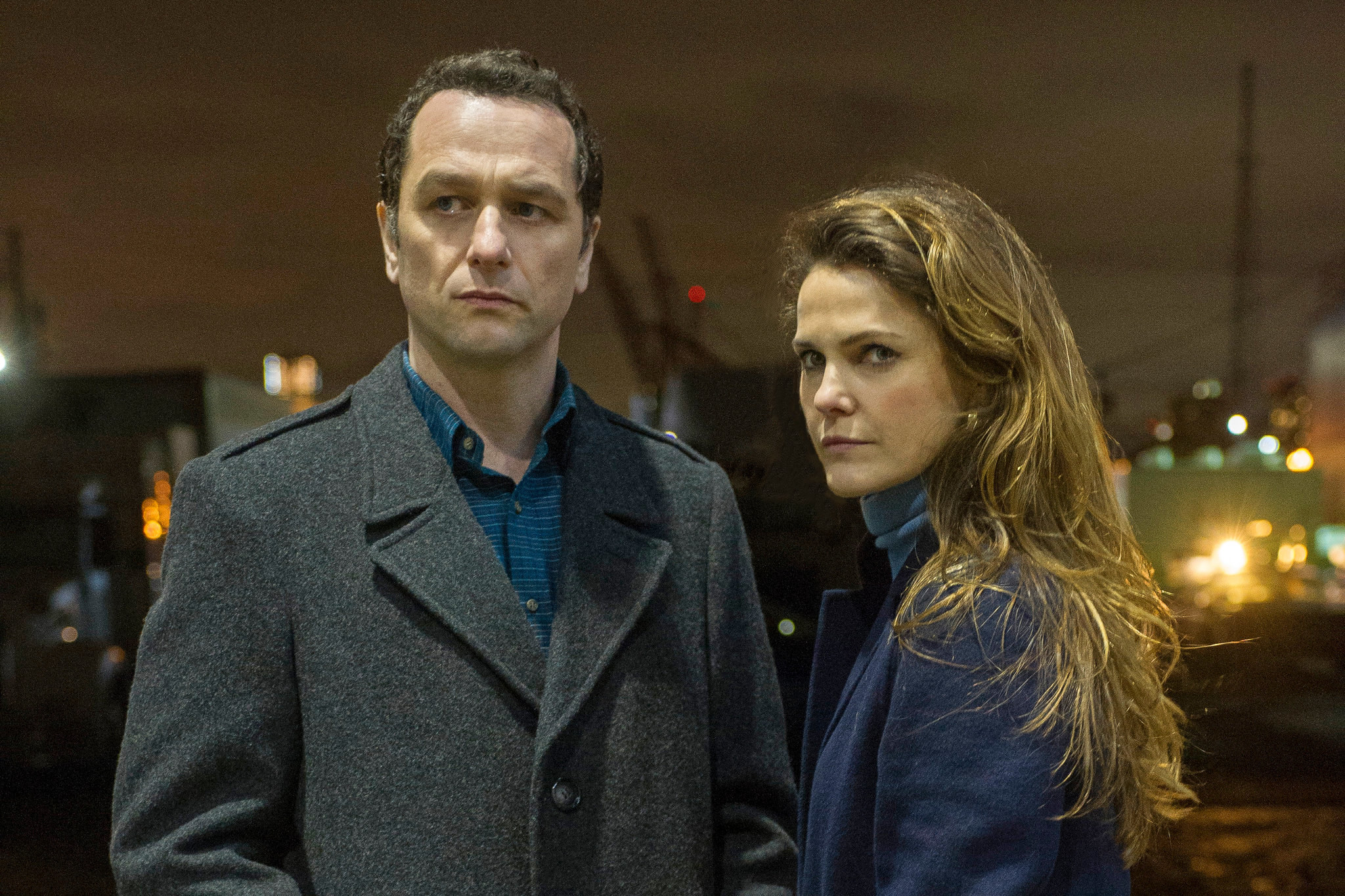 Matthew Rhys and Keri Russell as Philip and Elizabeth Jennings stood together at a dock during the night in &quot;The Americans&quot;
