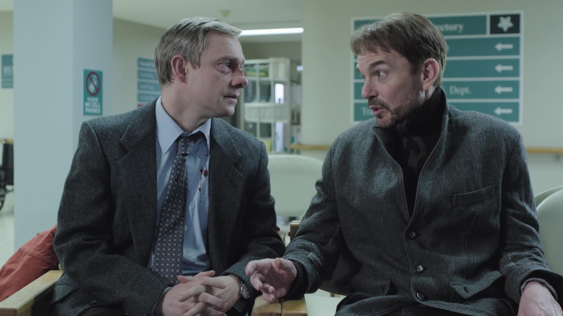 Martin Freeman as an injured Lester Nygaard talks with Lorne Malvo played by Billy Bob Thorton in a hospital in &quot;Fargo&quot;