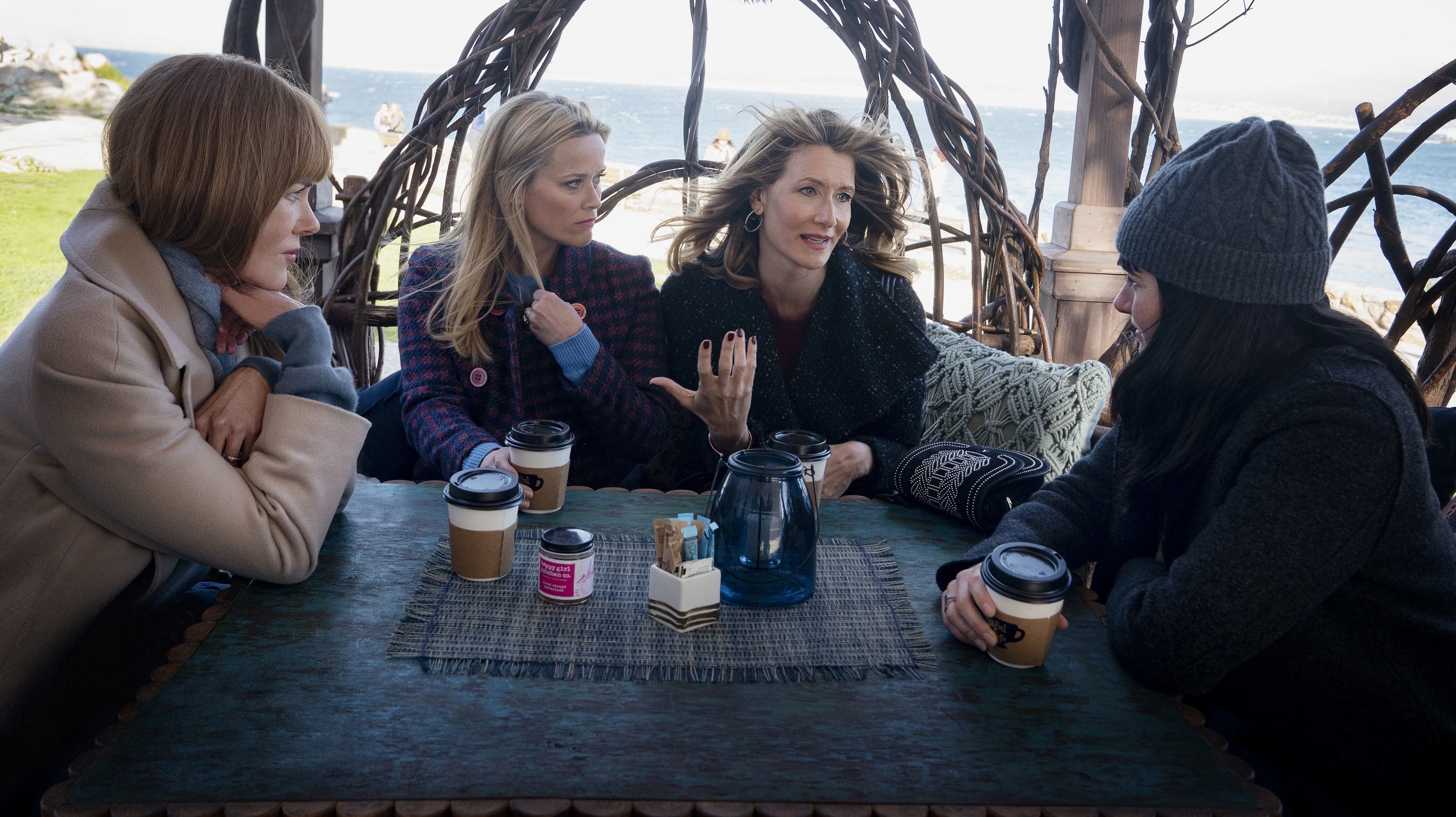 Nicole Kidman as Celeste Reese Witherspoon as Madeline Laura Dern as Renata and Shailene Woodley as Jane drinking coffee and talking at a table outdoors in &quot;Big Little Lies&quot;