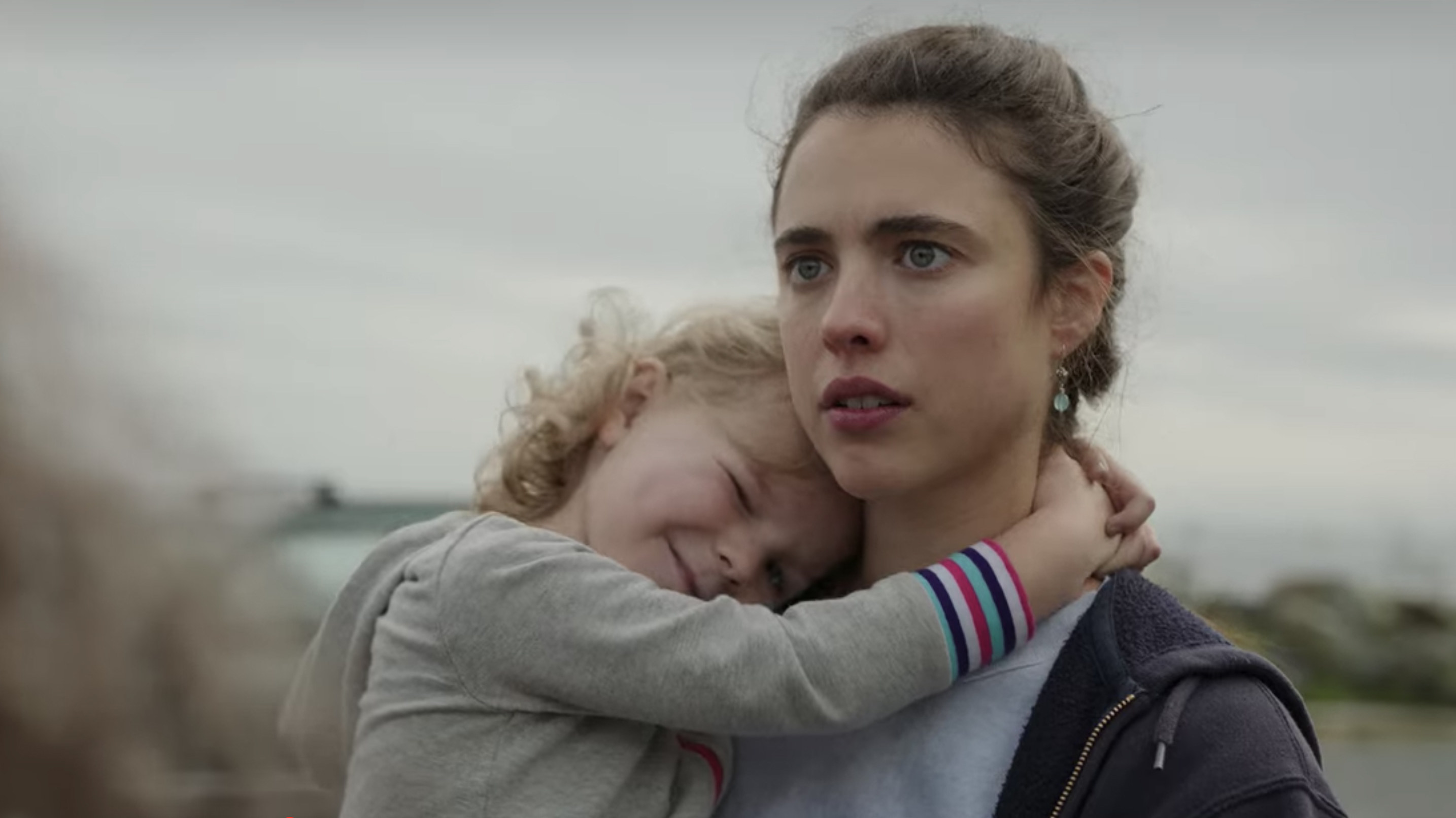 Margaret Qualley as Alex Russell concerned as she holds her happy daughter Maddy played by Rylea Nevaeh Whittet in &quot;Maid&quot;