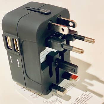 a reviewer photo of the wall adaptor with all of the prongs folded outward