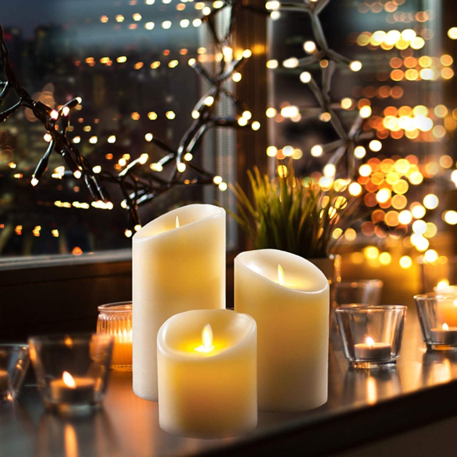 Three flameless candles surrounded by tea lights
