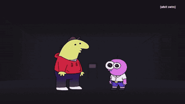 The two characters standing in a dark and empty room