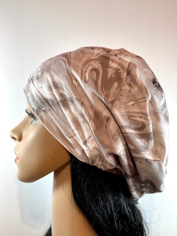 gray tie-dye scrub cap on a mannequin head