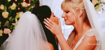 Brittany and Santana from glee kissing at their wedding