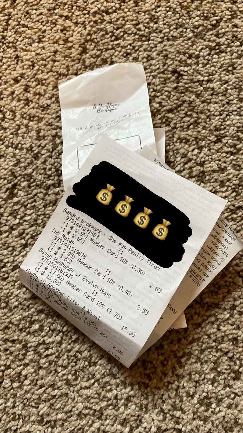 Folded receipts in a pile on a carpet marked up