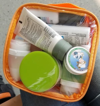 a reviewer photo of all the toiletries packed into the bag