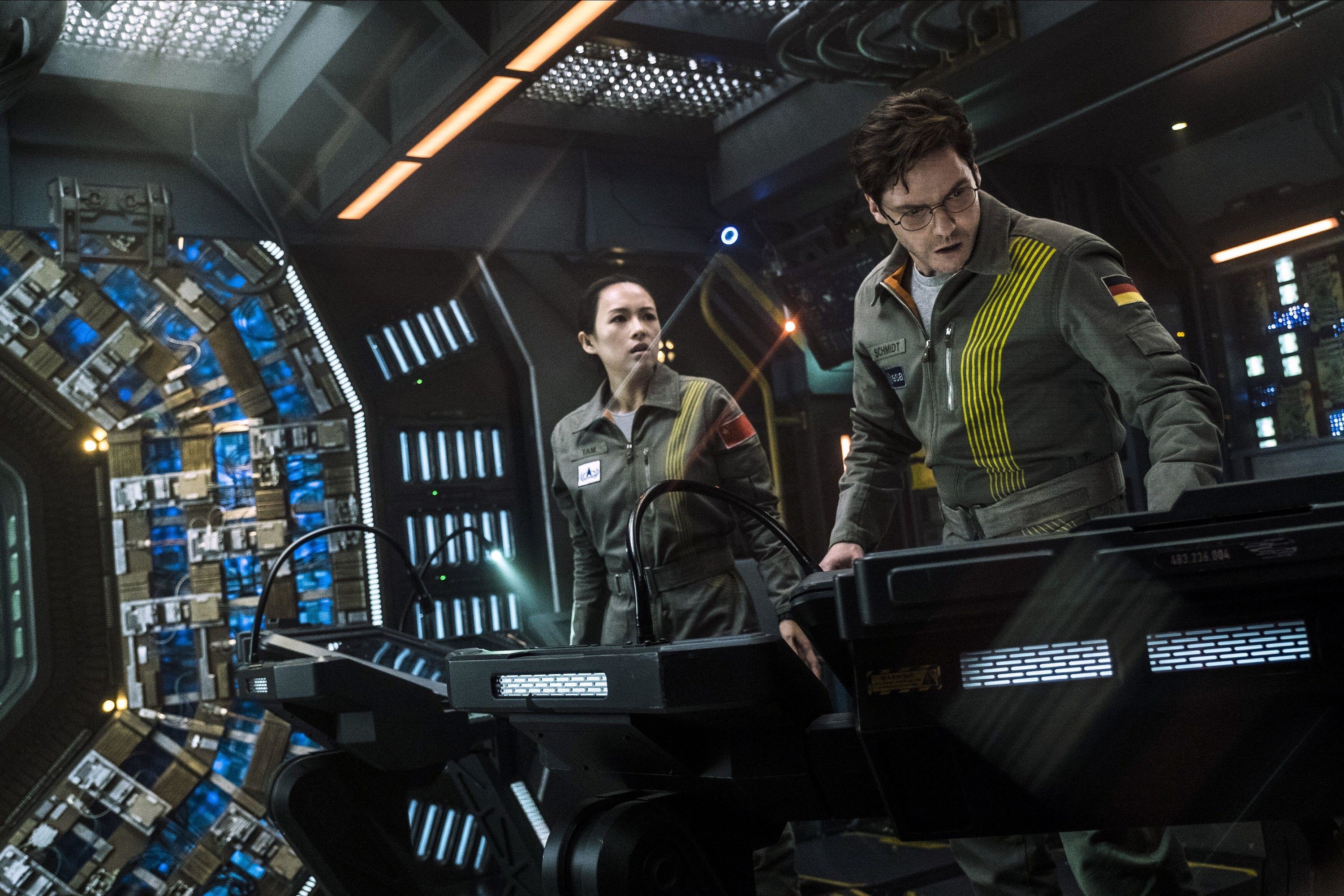 Zhang Ziyi and Daniel Bruhl in “The Cloverfield Paradox”