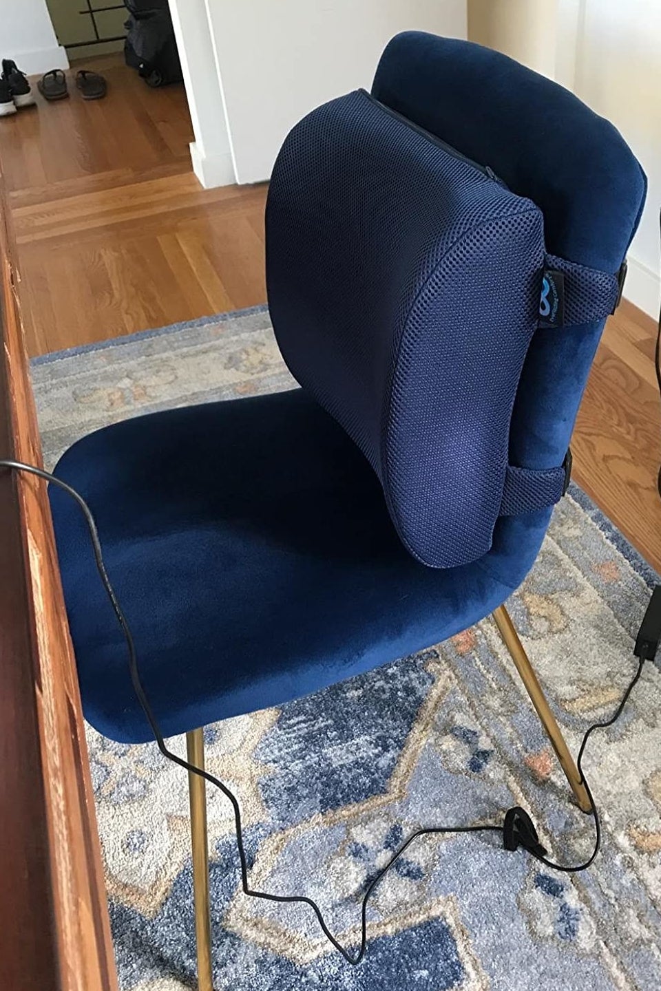 different reviewer's chair with matching lumbar support pillow attached