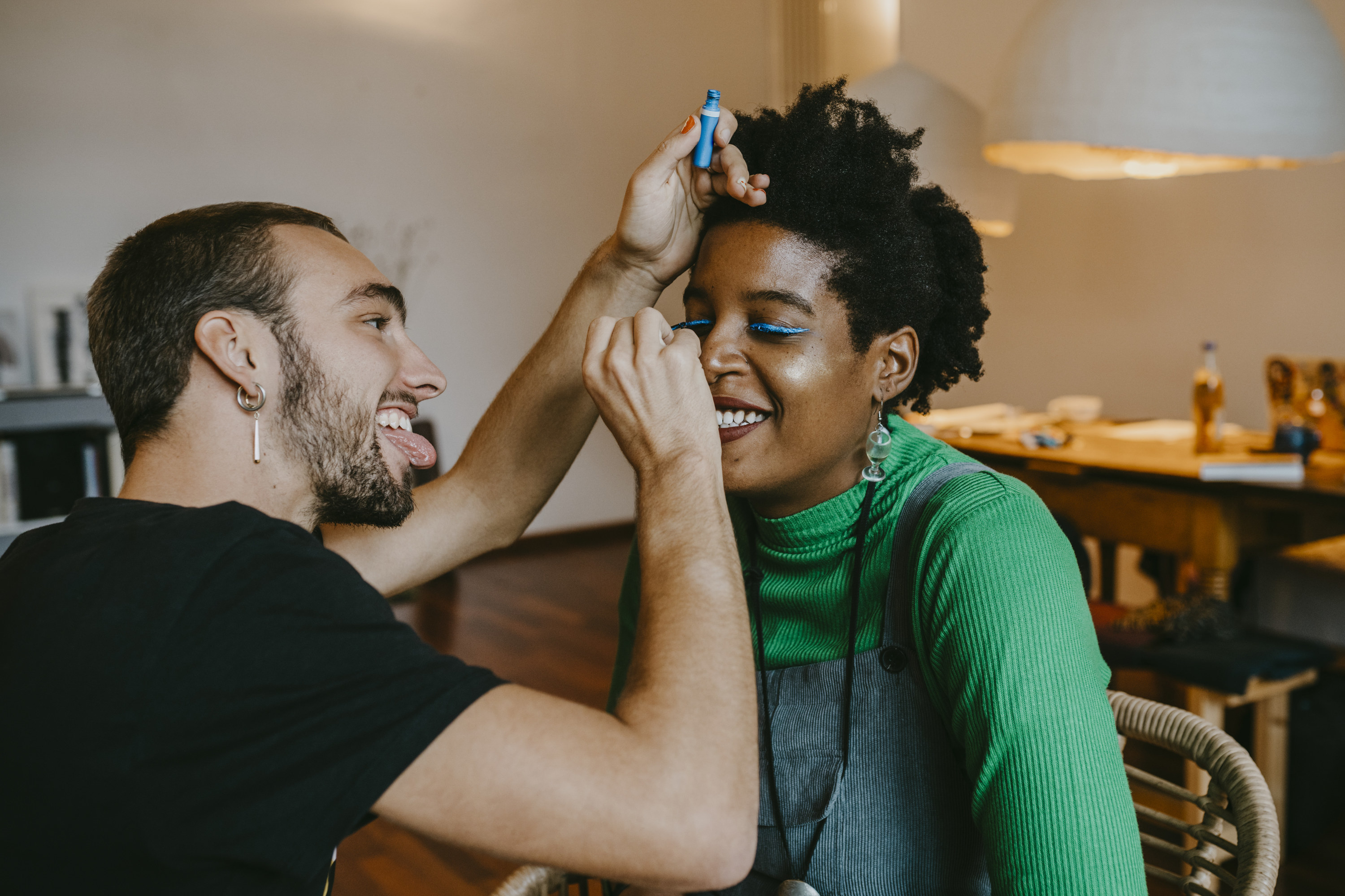 A friend doing another friend&#x27;s makeup